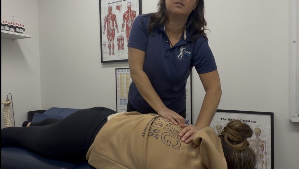 Image of a Gregory Hills Chiropractor adjusting someone after they've been sick with coughing and sinus congestion.